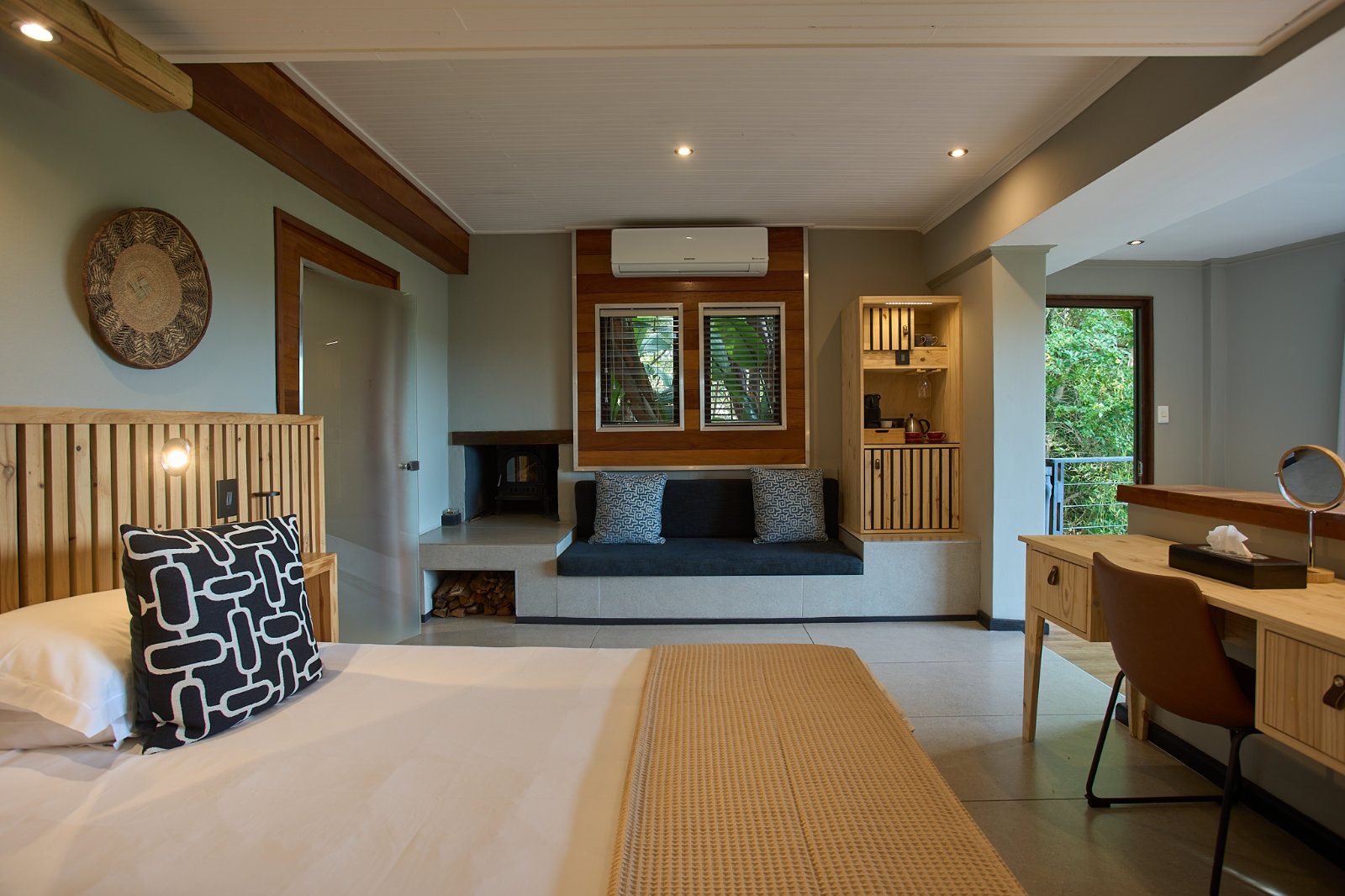 A suite fireplace, lit for a cool Garden Route evening